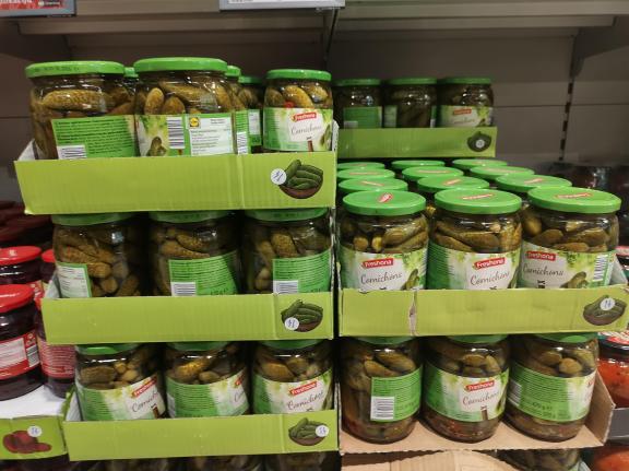 Pickled cucumbers in glass retail packaging in a supermarket