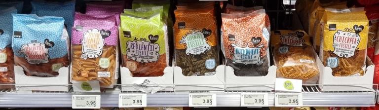 Protein-rich pasta products in a European supermarket shelf