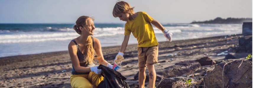 People picking up litter from a beach